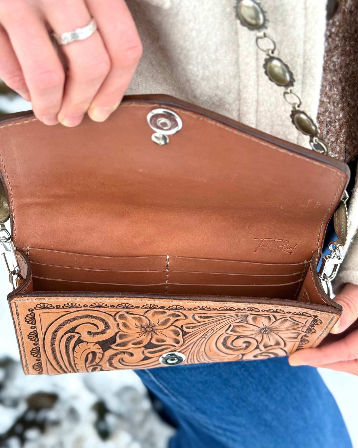 Small tooled leather cross body purse with CH designs turquoise