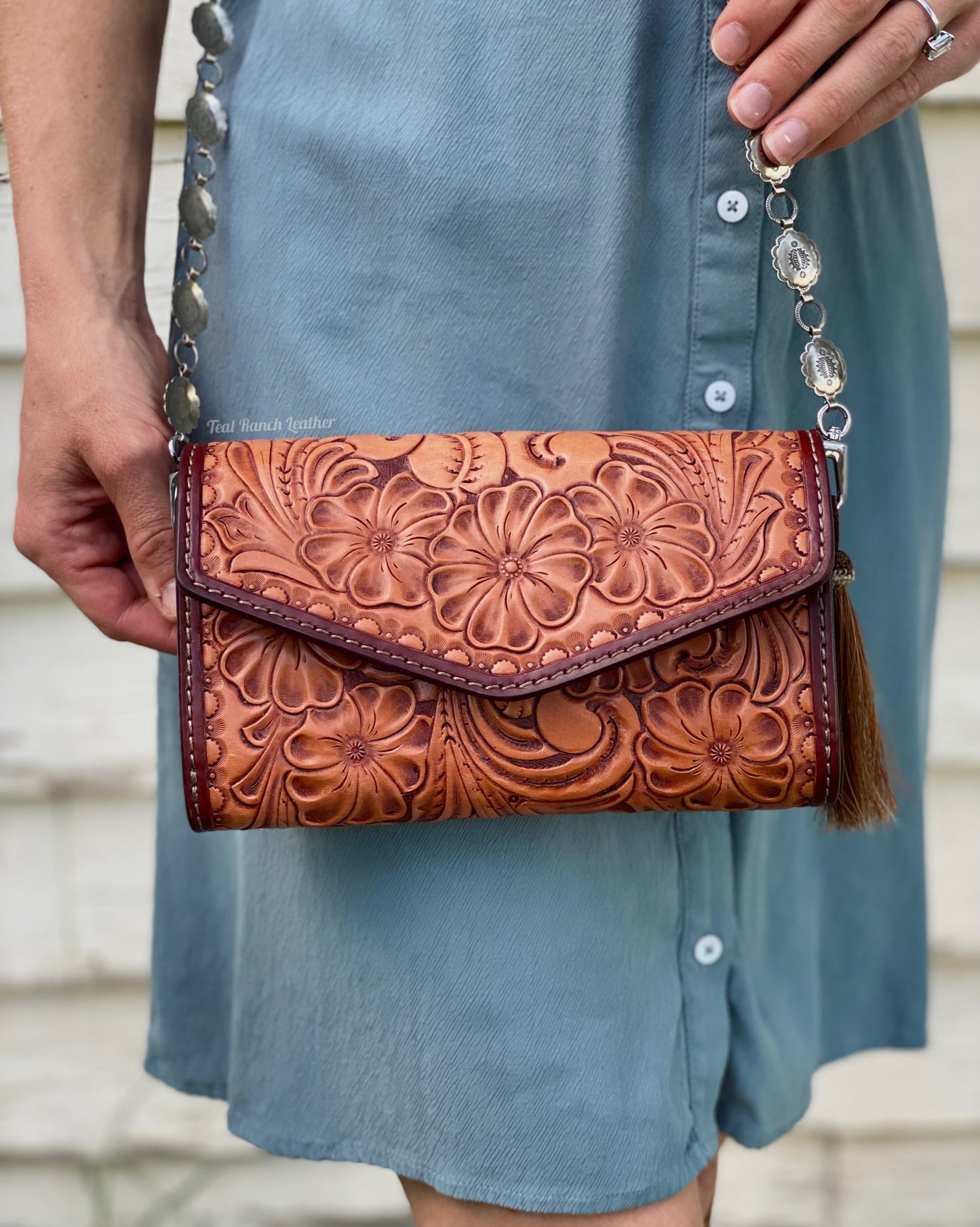 Small fully tooled leather cross body purse with concho chain