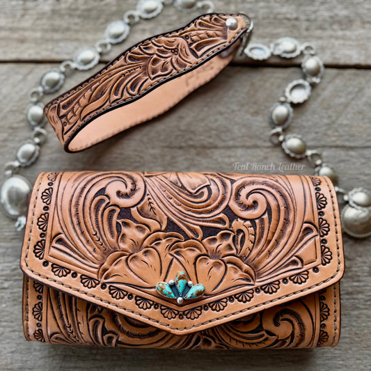 Small tooled leather cross body purse with CH designs turquoise