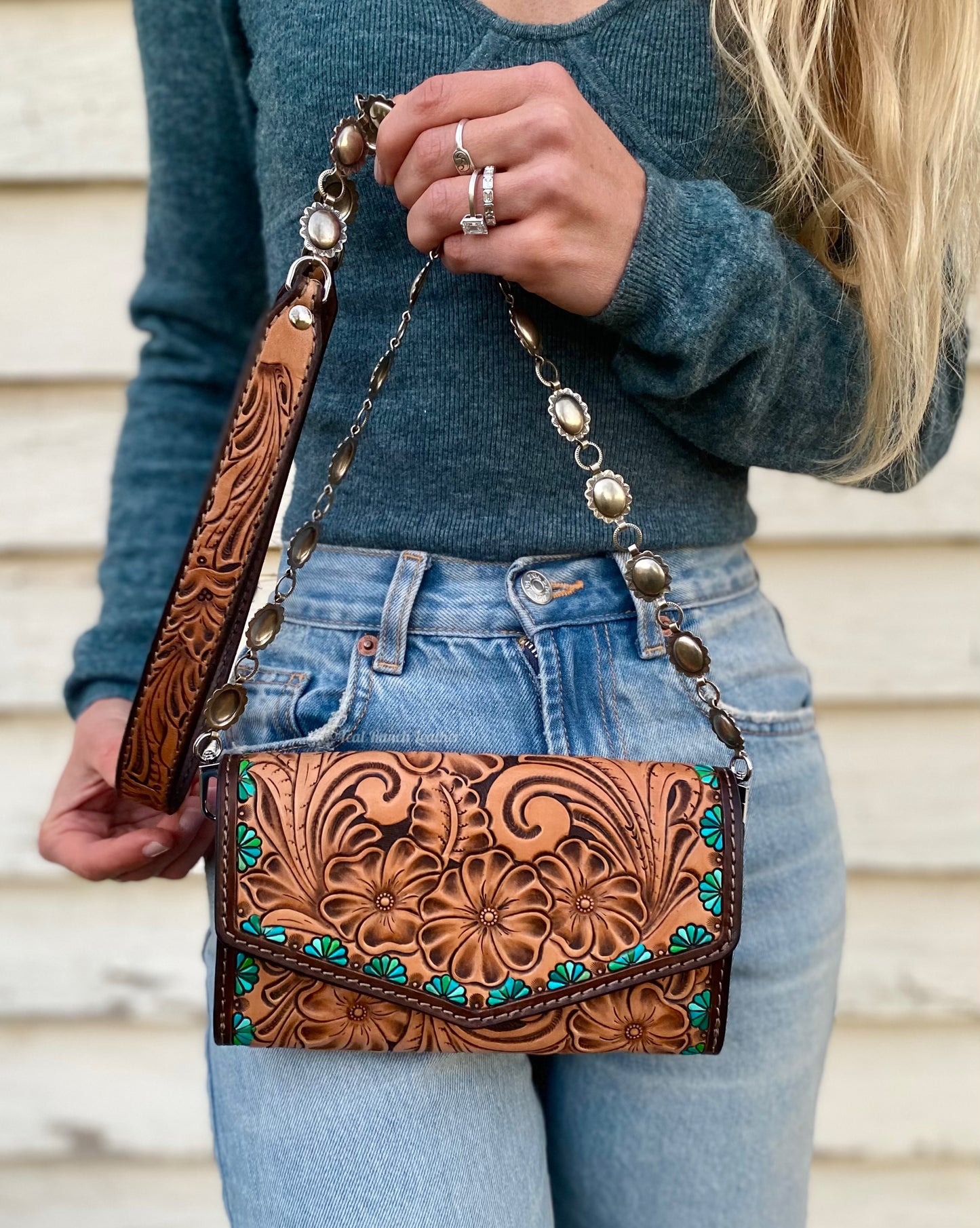 Small tooled cross body purse with concho chain and turquoise accents