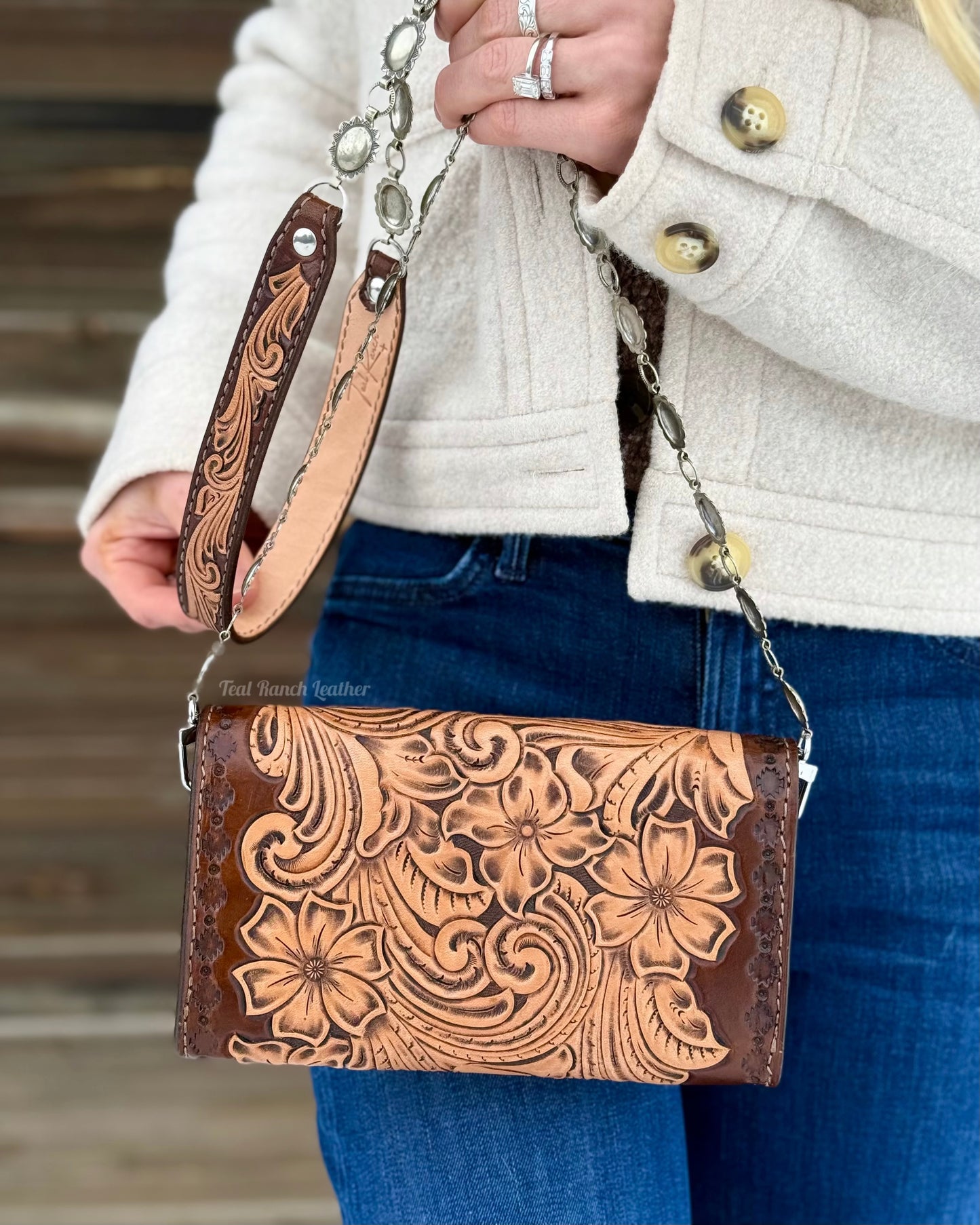 Small tooled leather cross body purse with CH designs turquoise