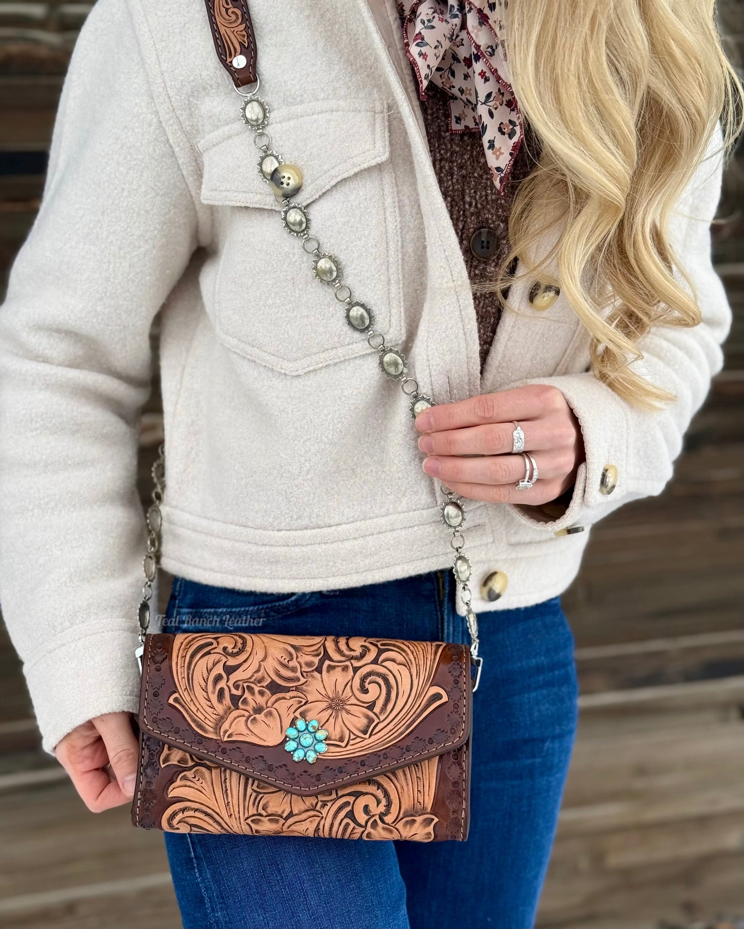 Small tooled leather cross body purse with CH designs turquoise