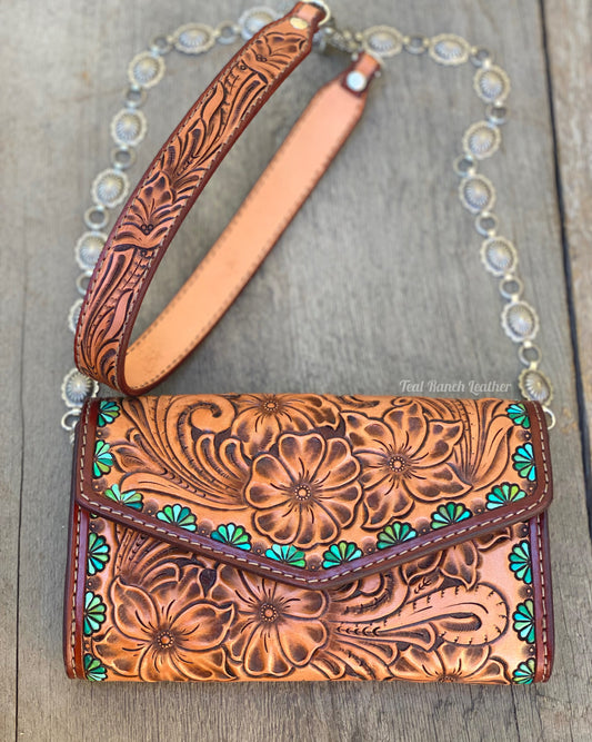 Small tooled cross body purse with concho chain and turquoise accents