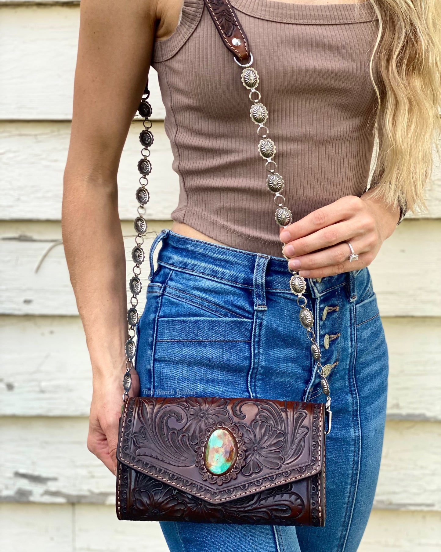 Small dark brown tooled leather cross body purse with tyrone turquoise and concho chain