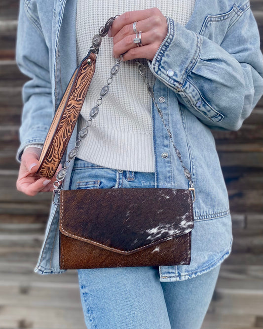 Small hair on hide cross body purse with tooled leather and concho chain- Dark longhorn