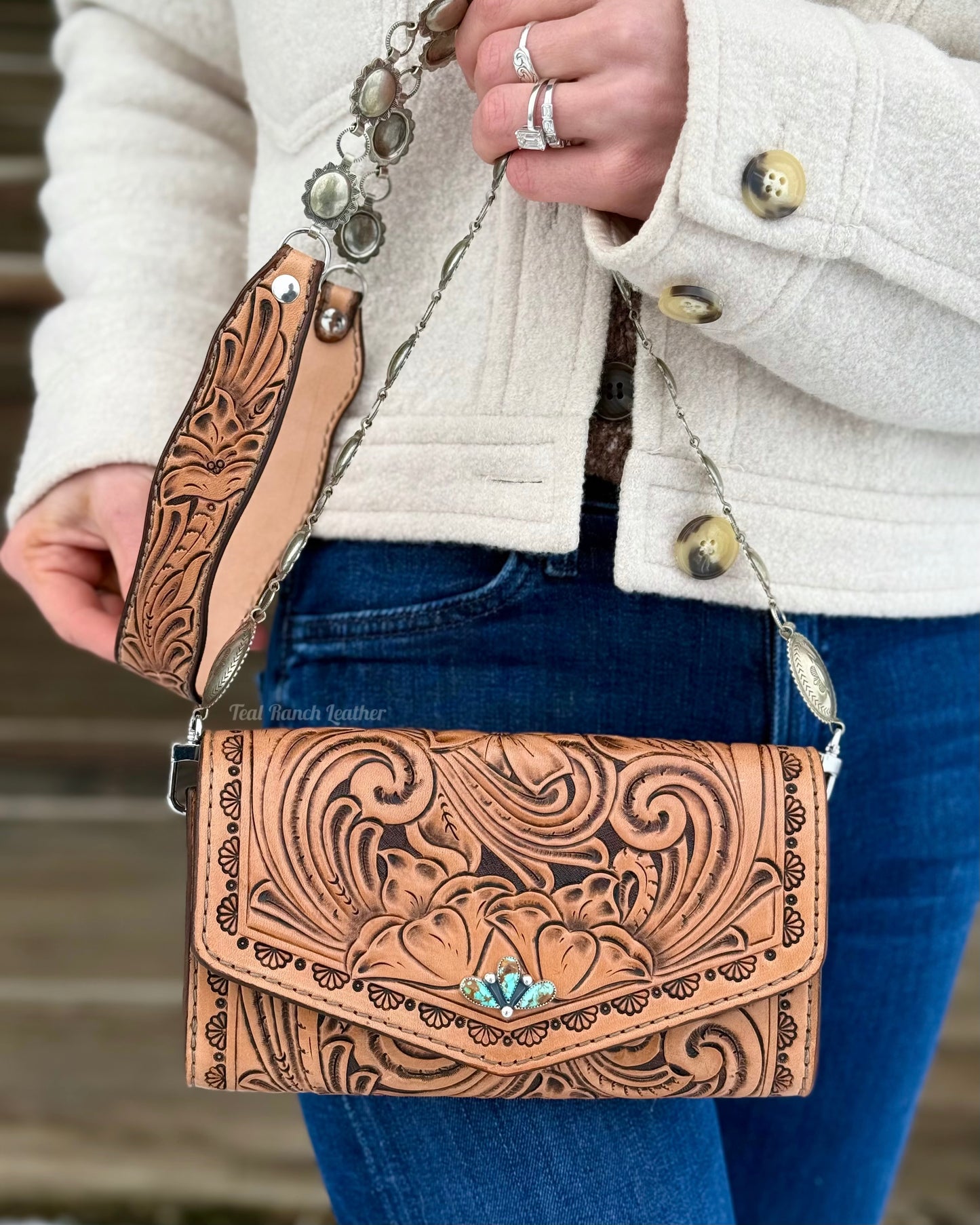 Small tooled leather cross body purse with CH designs turquoise