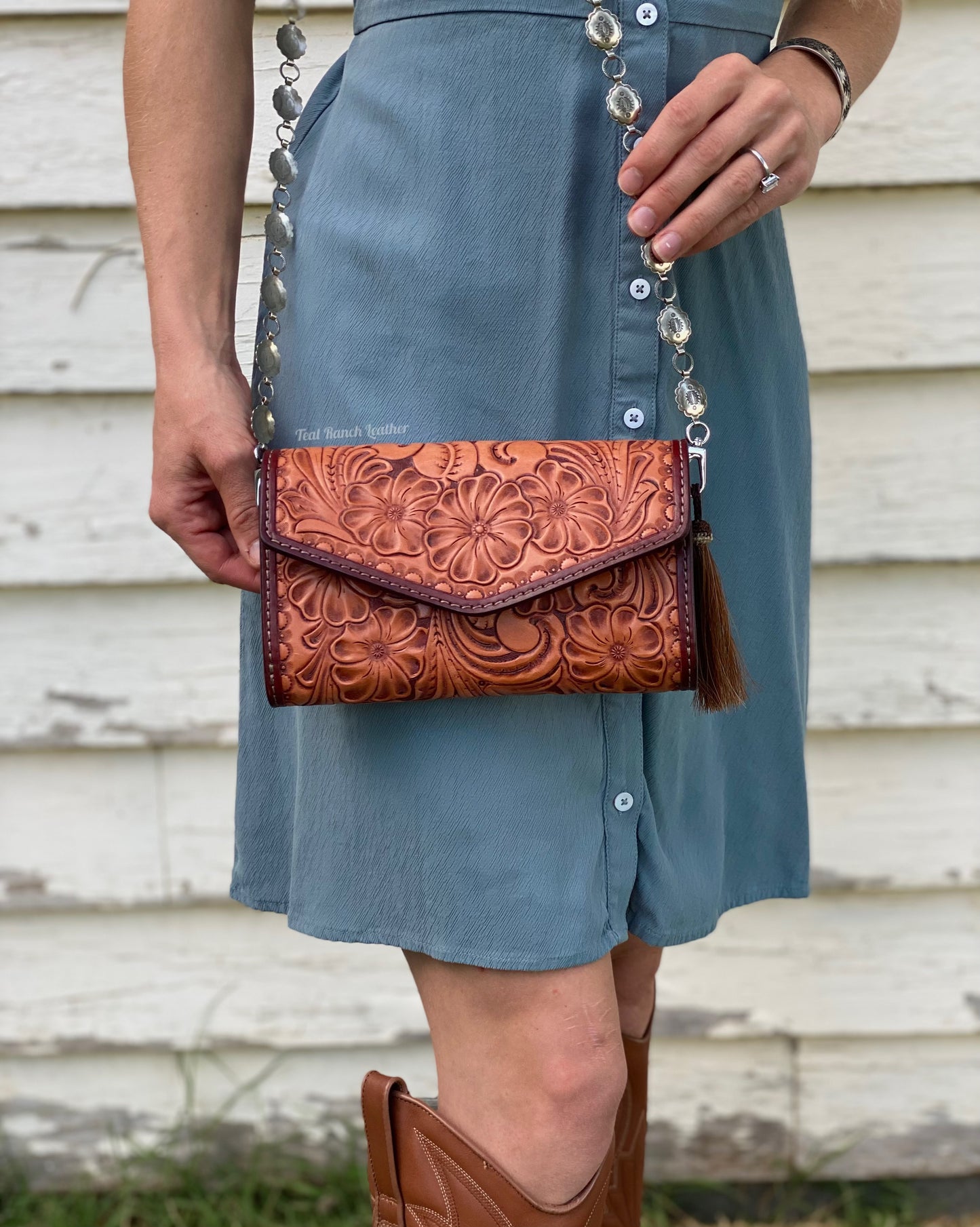 Small fully tooled leather cross body purse with concho chain