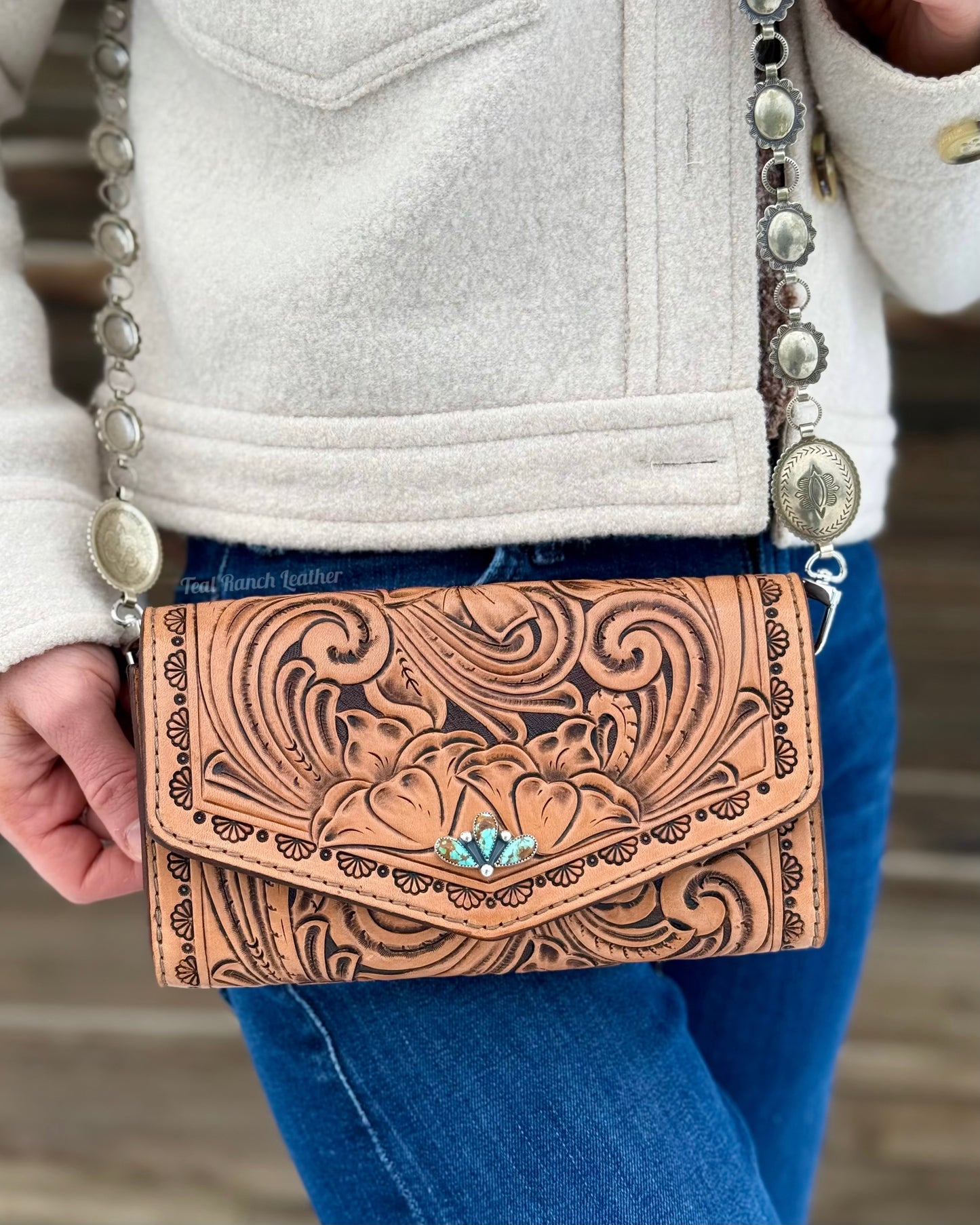 Small tooled leather cross body purse with CH designs turquoise