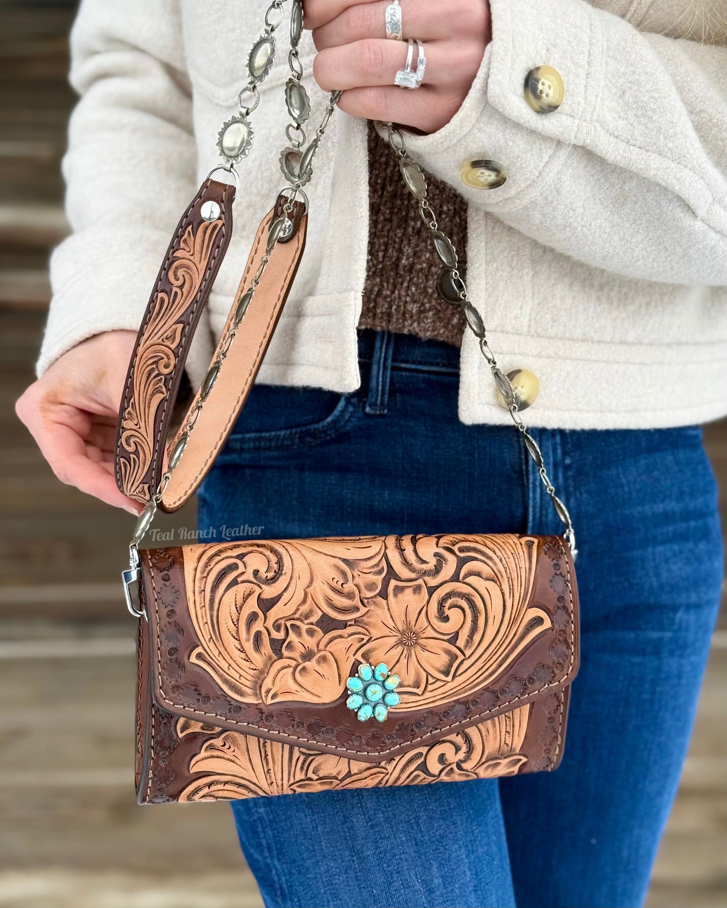 Small tooled leather cross body purse with CH designs turquoise