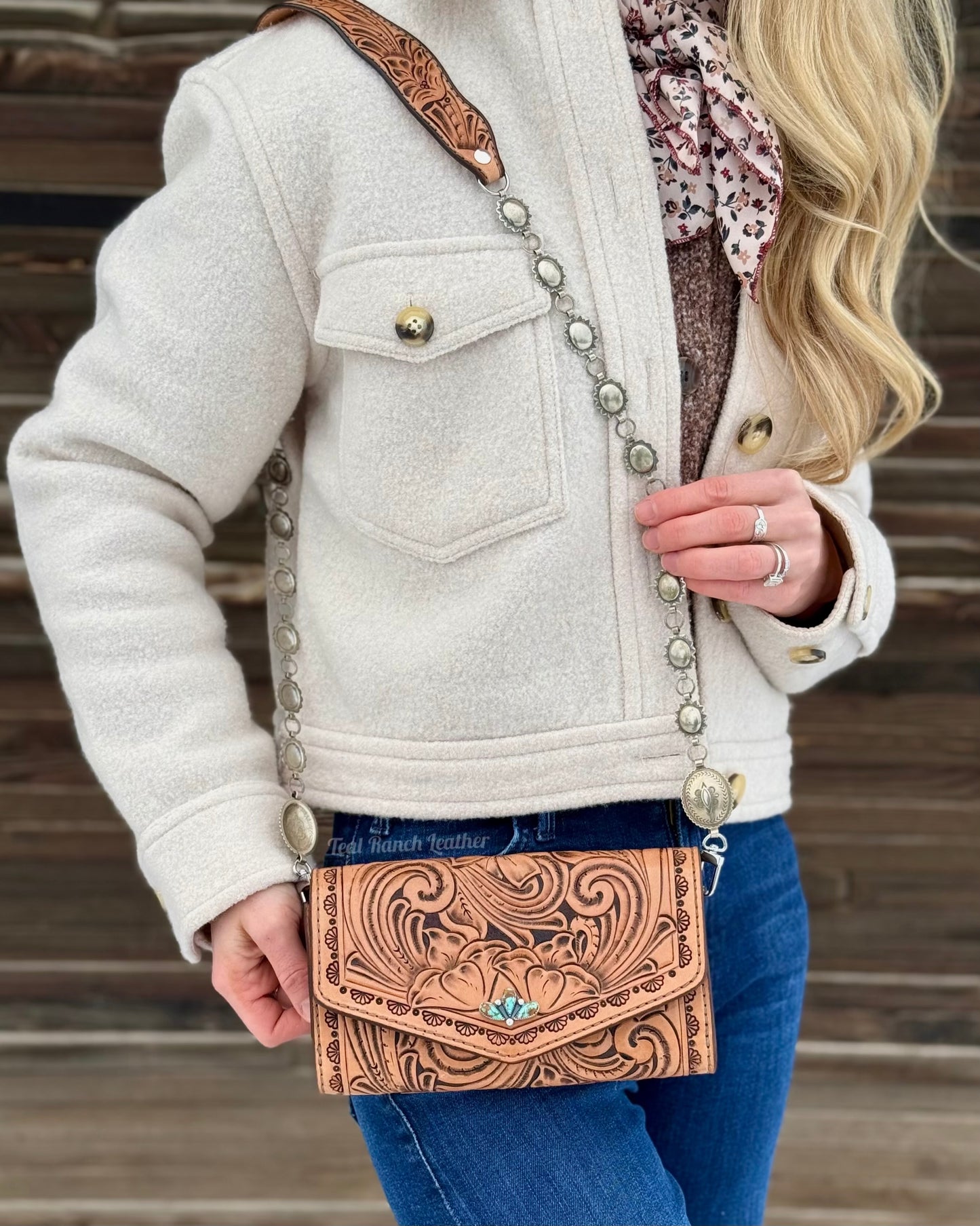 Small tooled leather cross body purse with CH designs turquoise