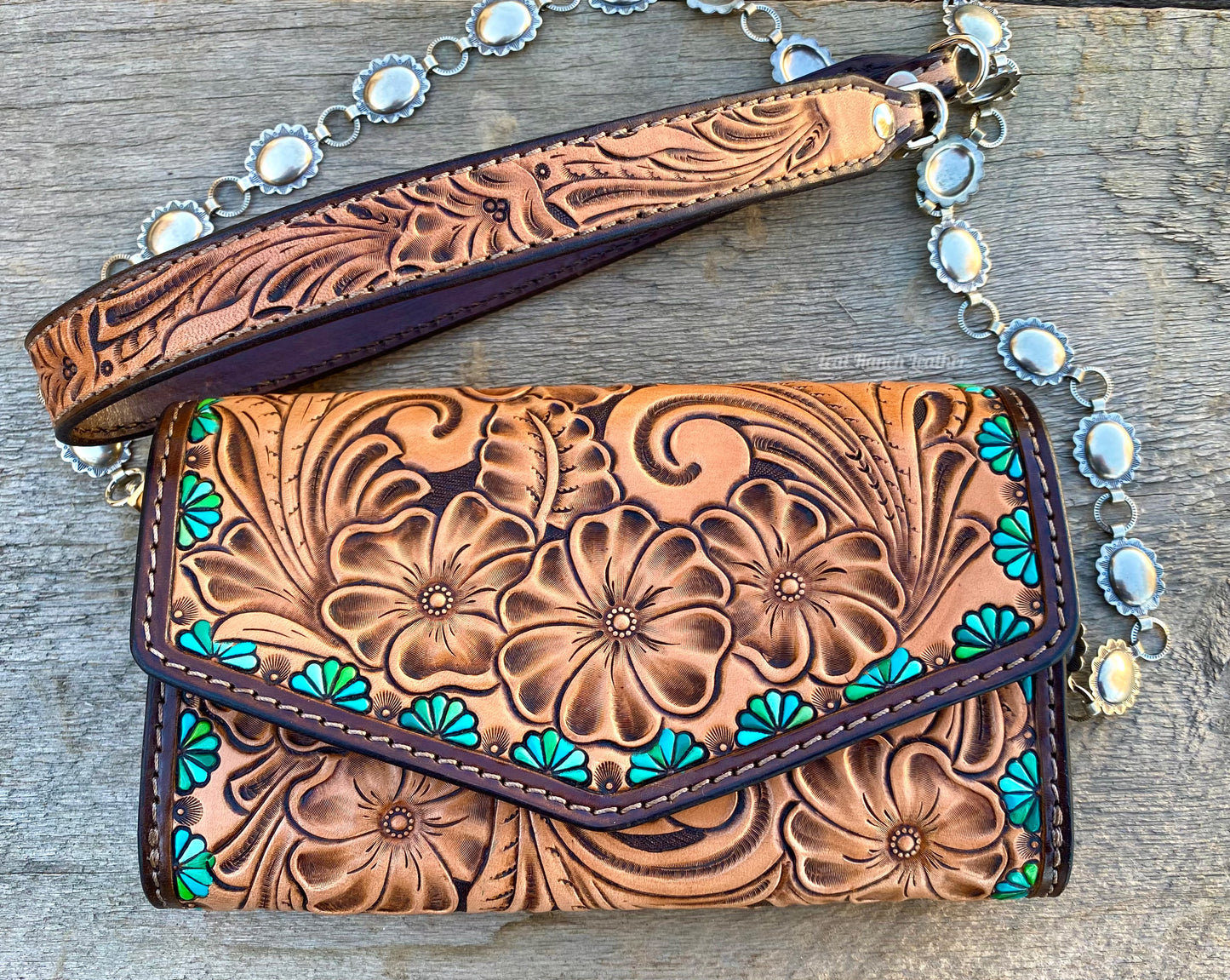 Small tooled cross body purse with concho chain and turquoise accents