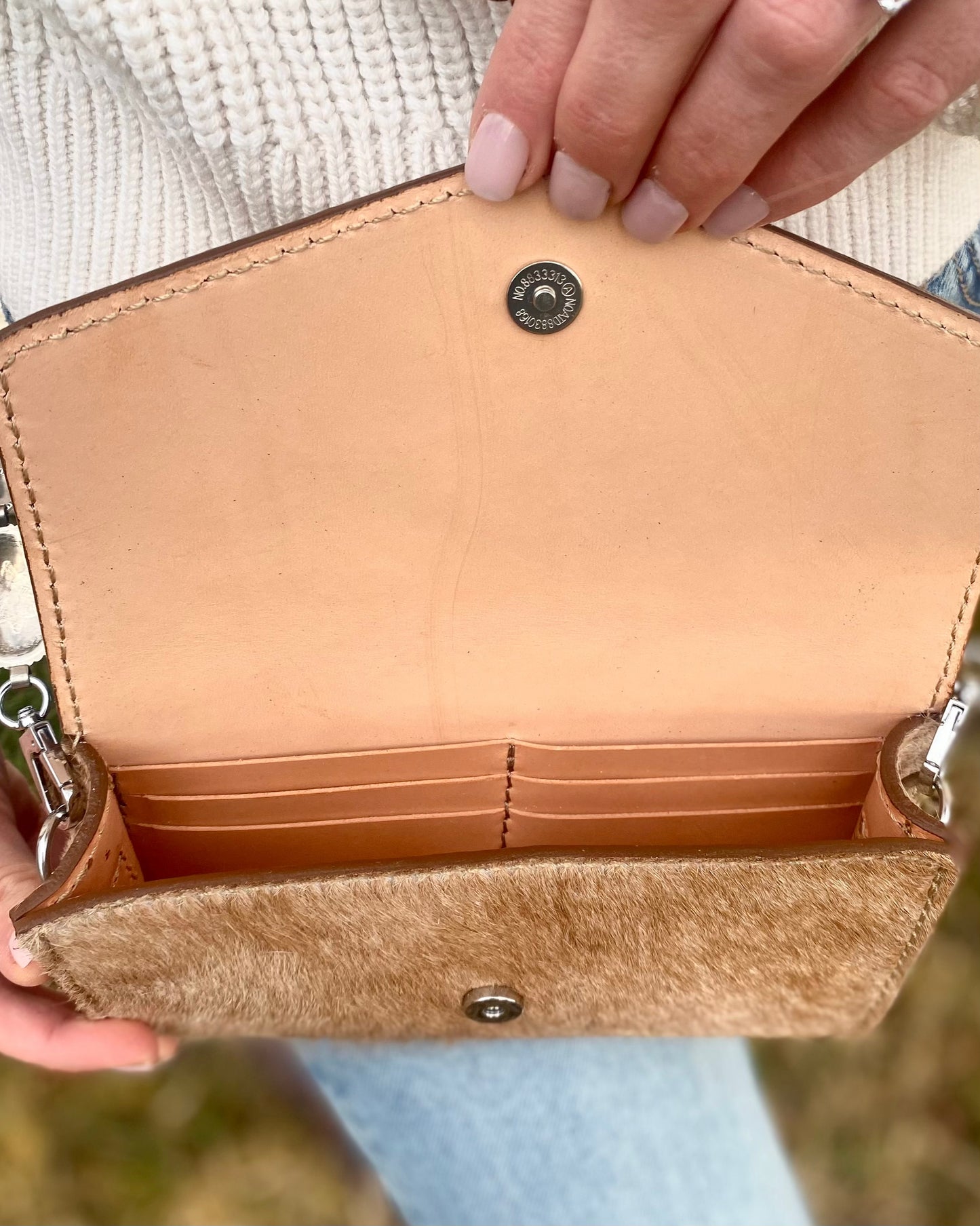 Small hair on hide cross body purse with tooled leather and concho chain- Light tan