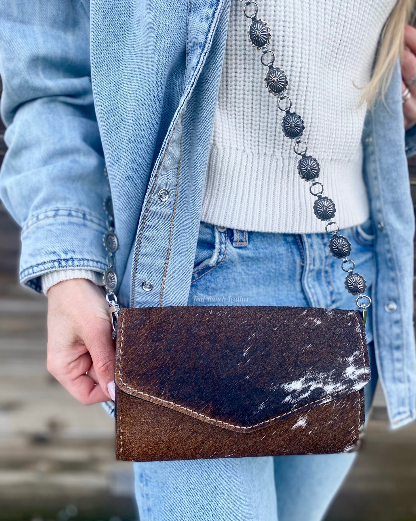 Small hair on hide cross body purse with tooled leather and concho chain- Dark longhorn