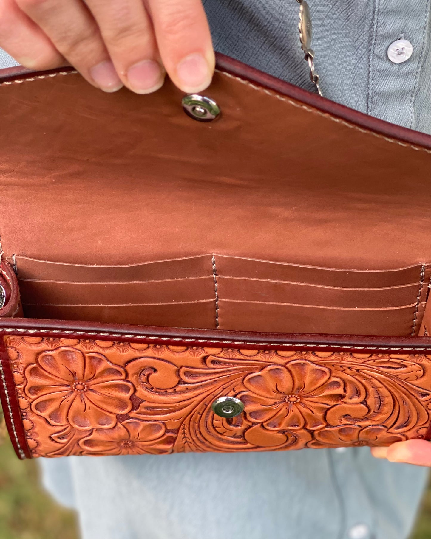 Small fully tooled leather cross body purse with concho chain