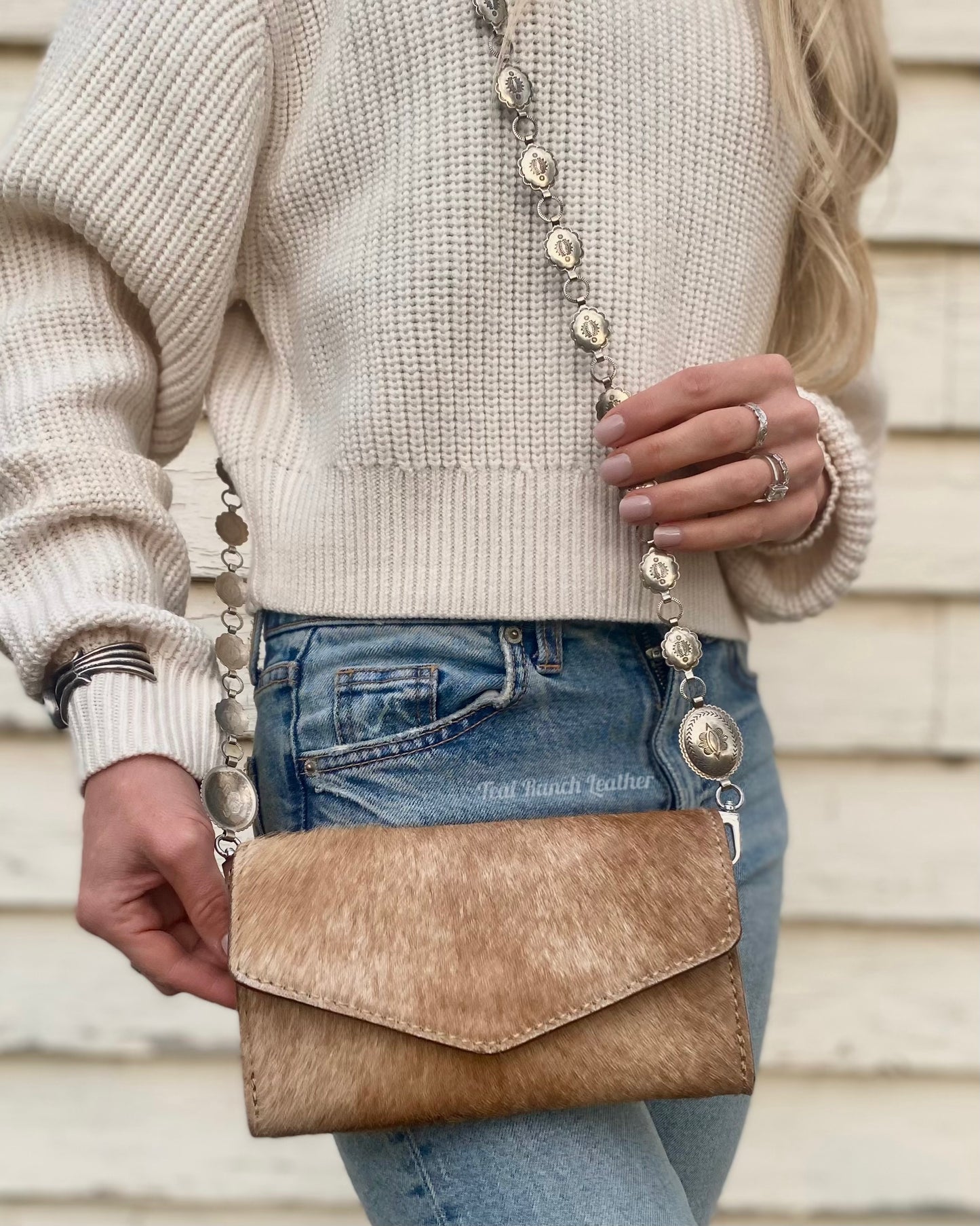 Small hair on hide cross body purse with tooled leather and concho chain- Light tan