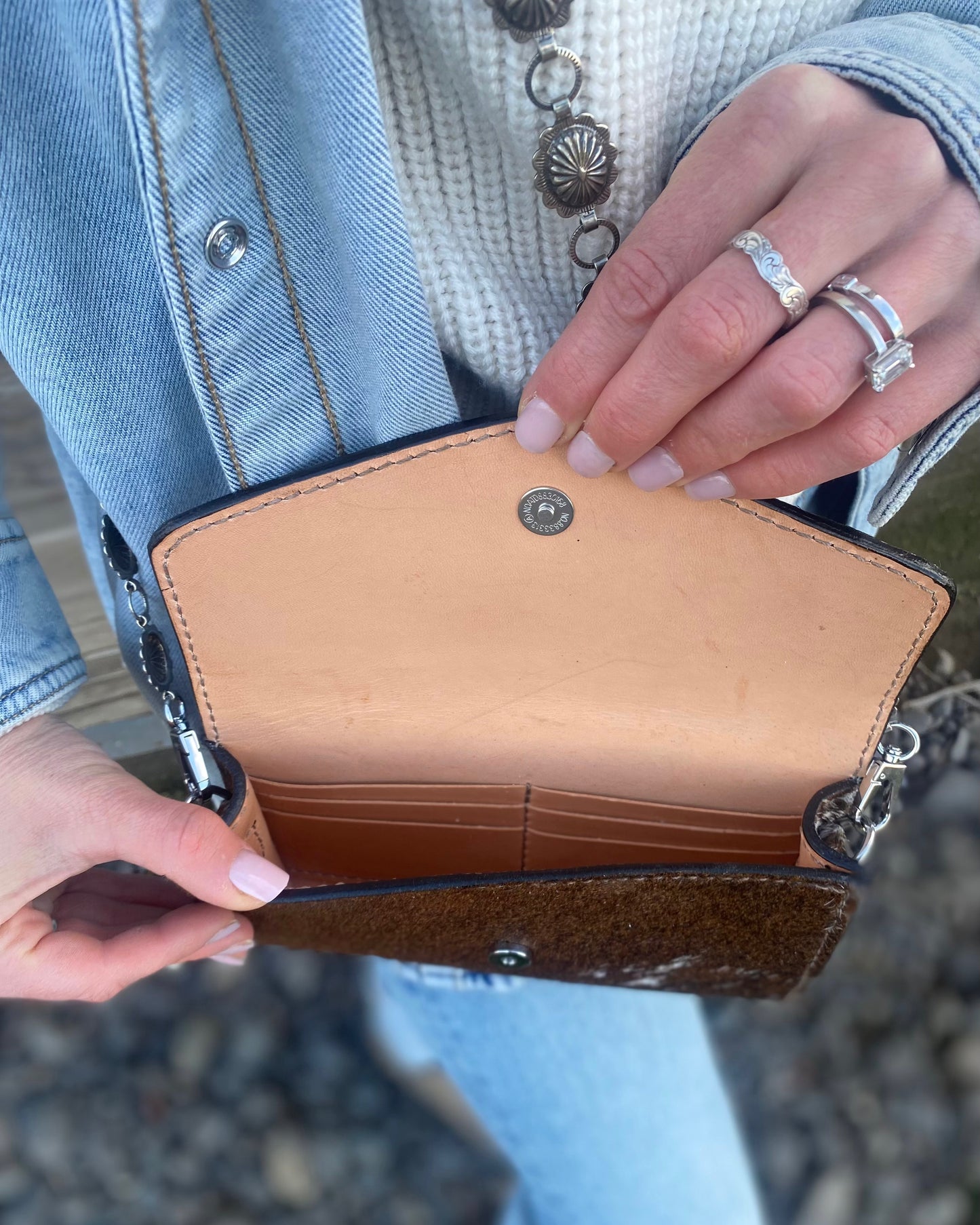 Small hair on hide cross body purse with tooled leather and concho chain- Dark longhorn