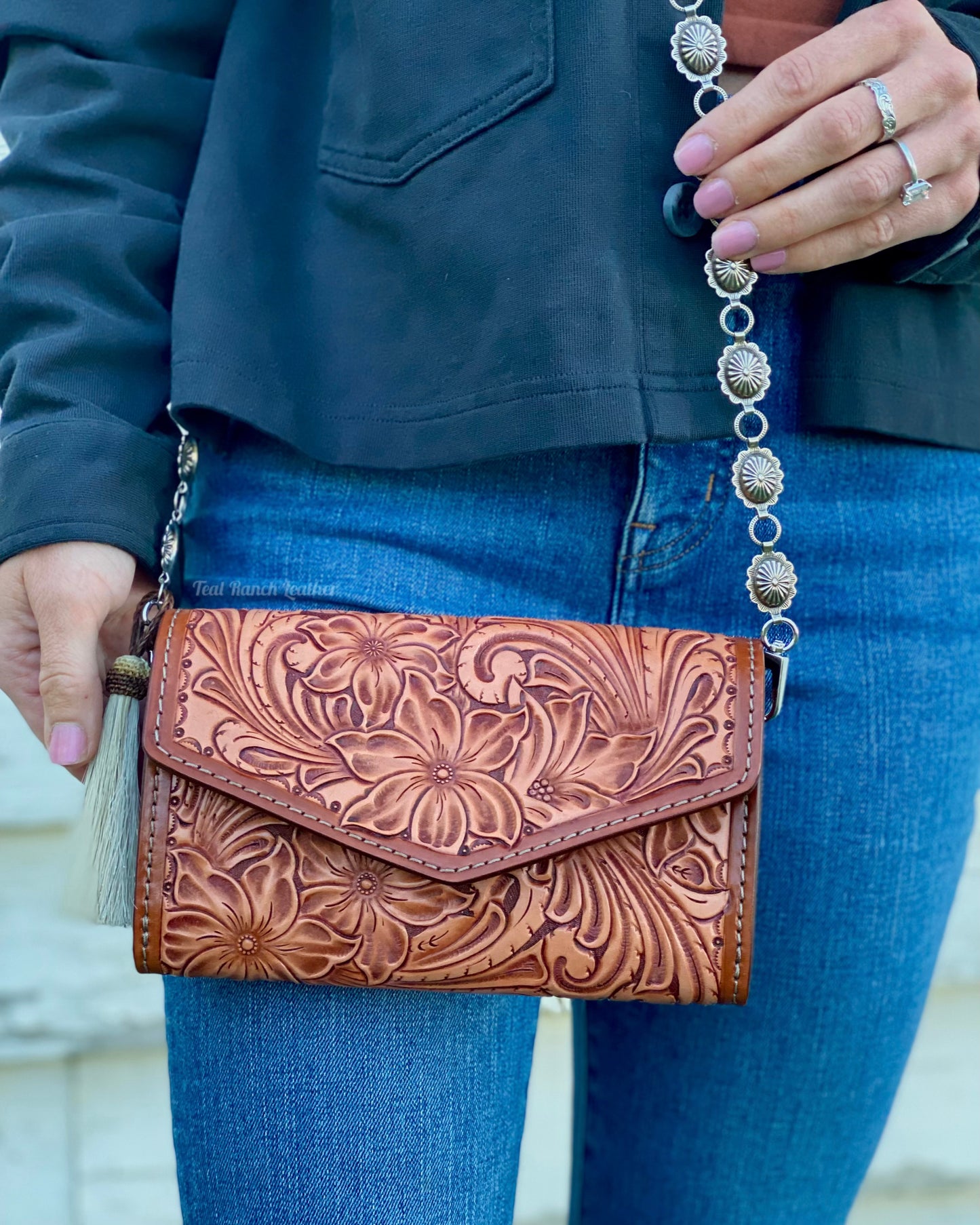 Small tooled cross body purse with concho chain