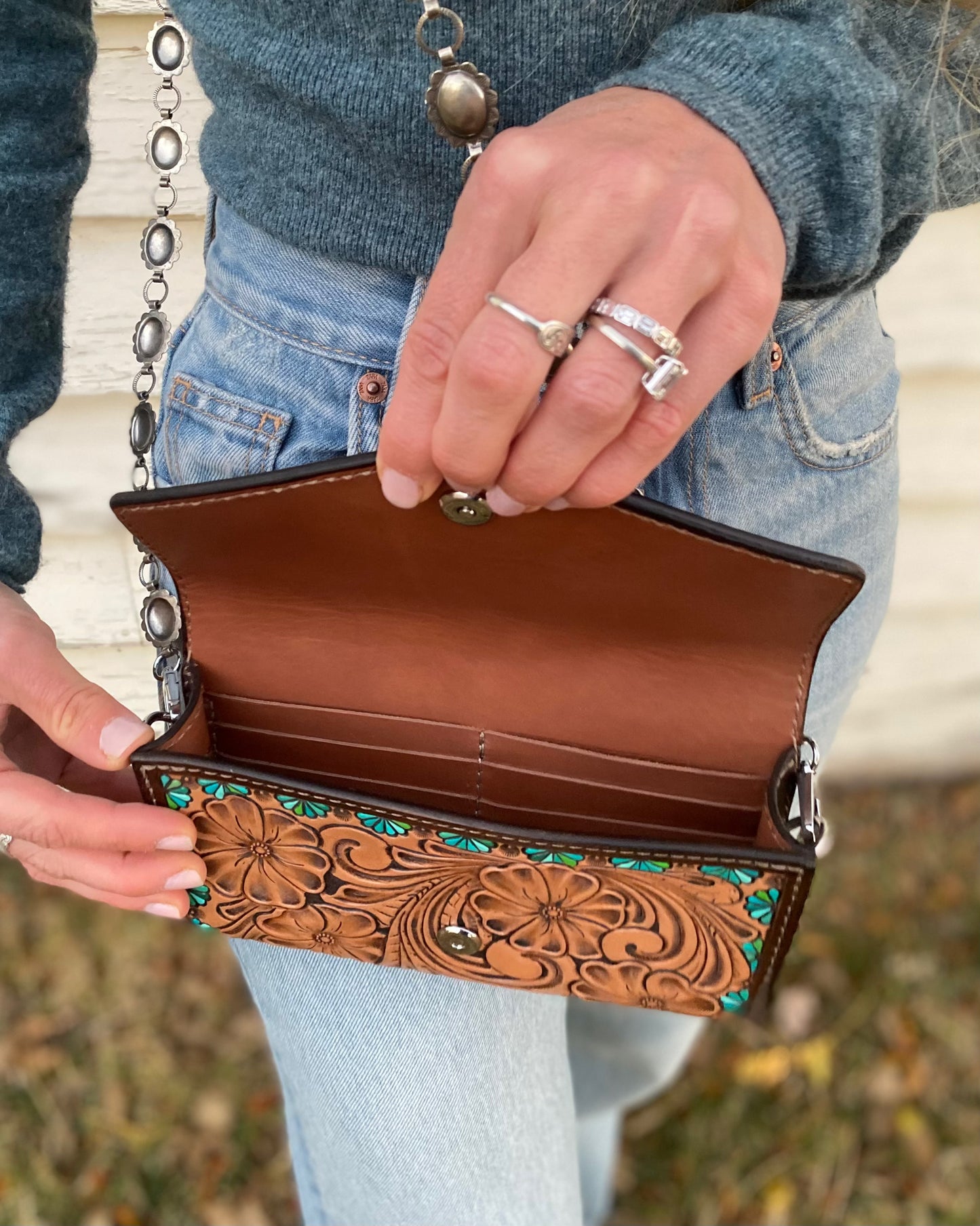 Small tooled cross body purse with concho chain and turquoise accents