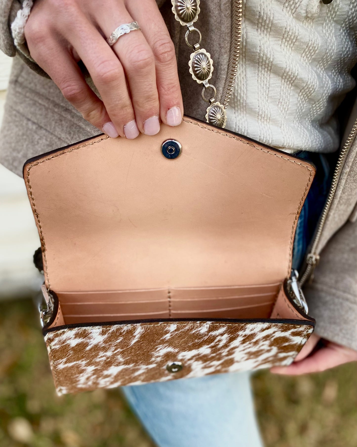 Small hair on hide cross body purse with tooled leather and concho chain-Light tan