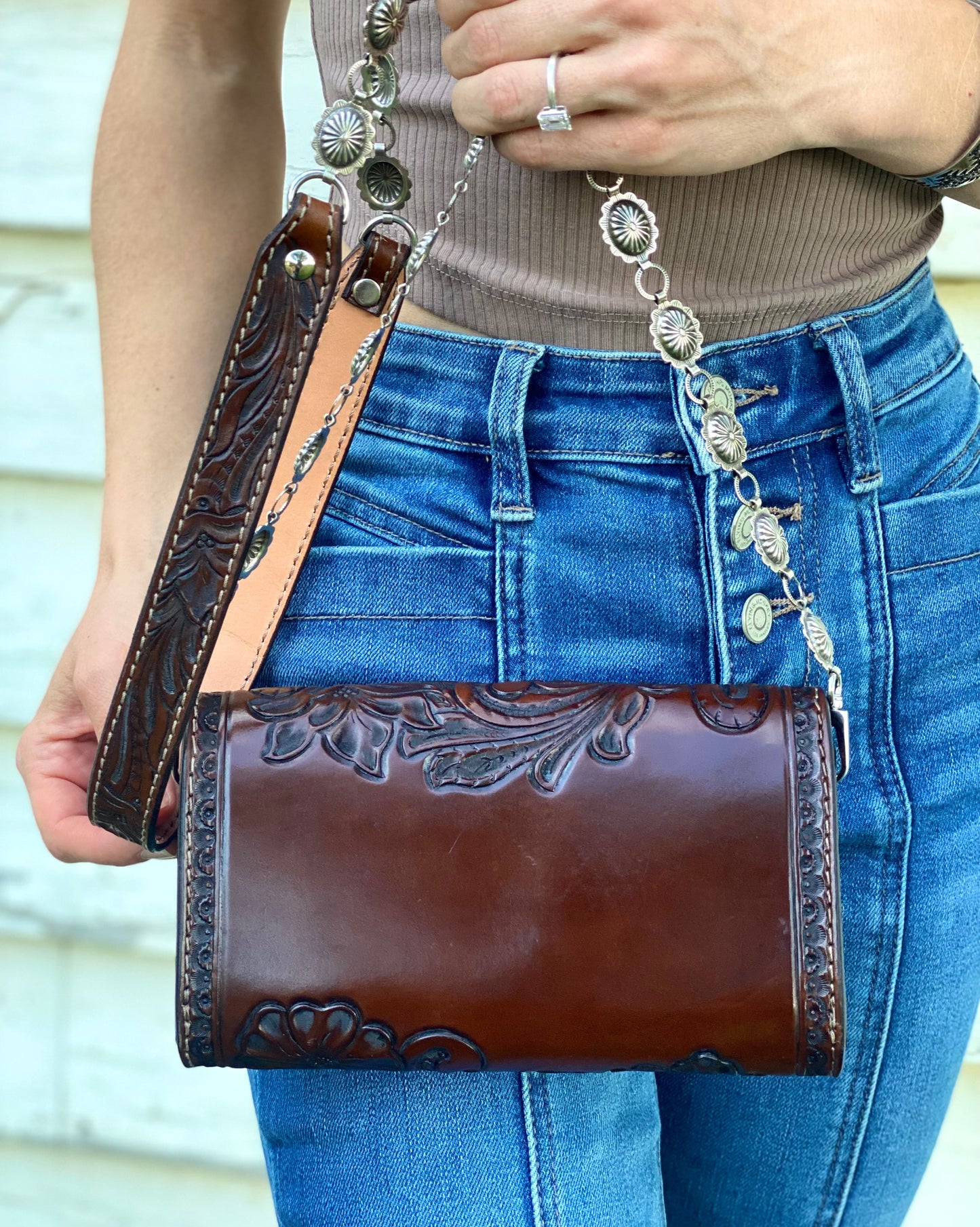 Small dark brown tooled leather cross body purse with tyrone turquoise and concho chain