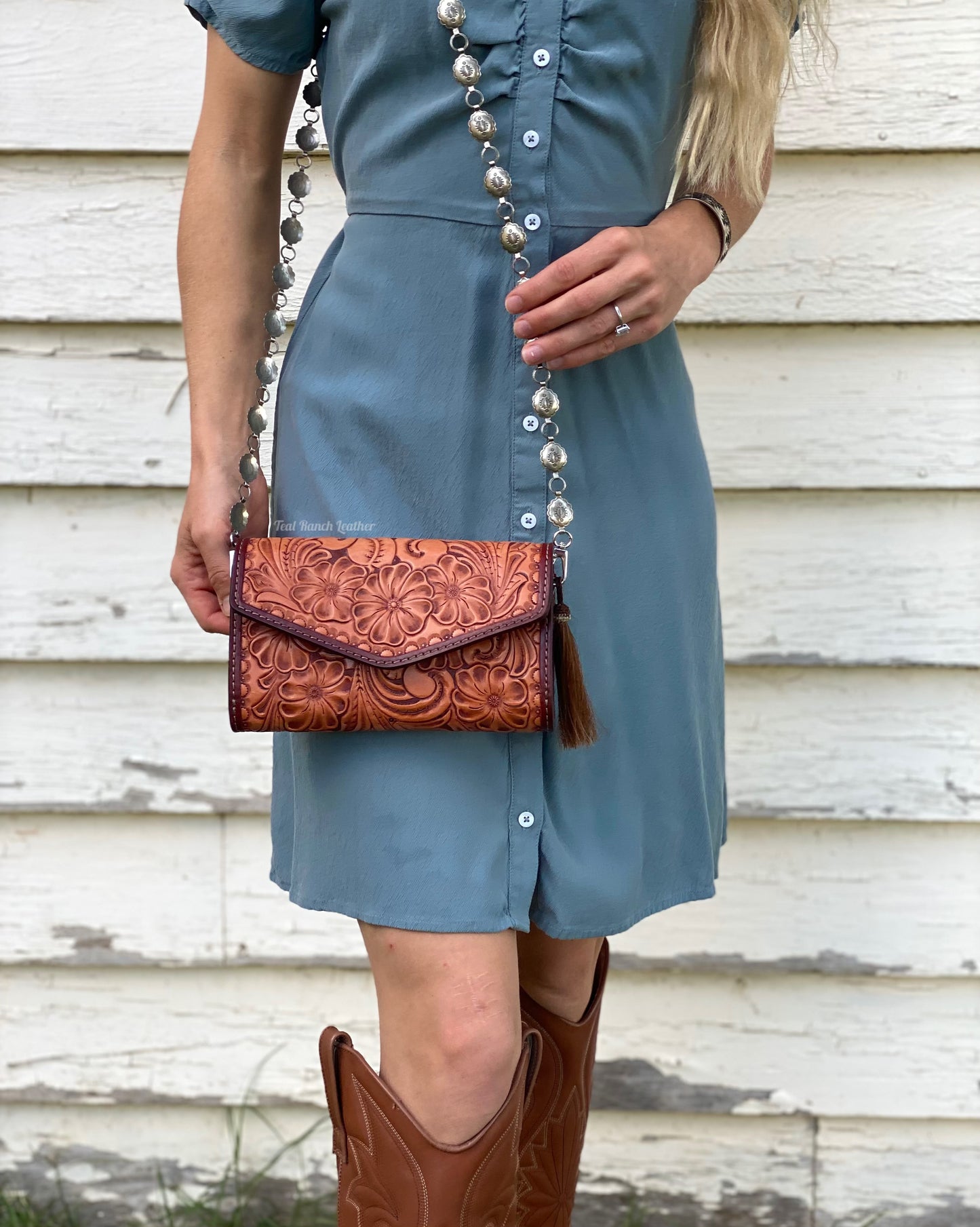 Small fully tooled leather cross body purse with concho chain