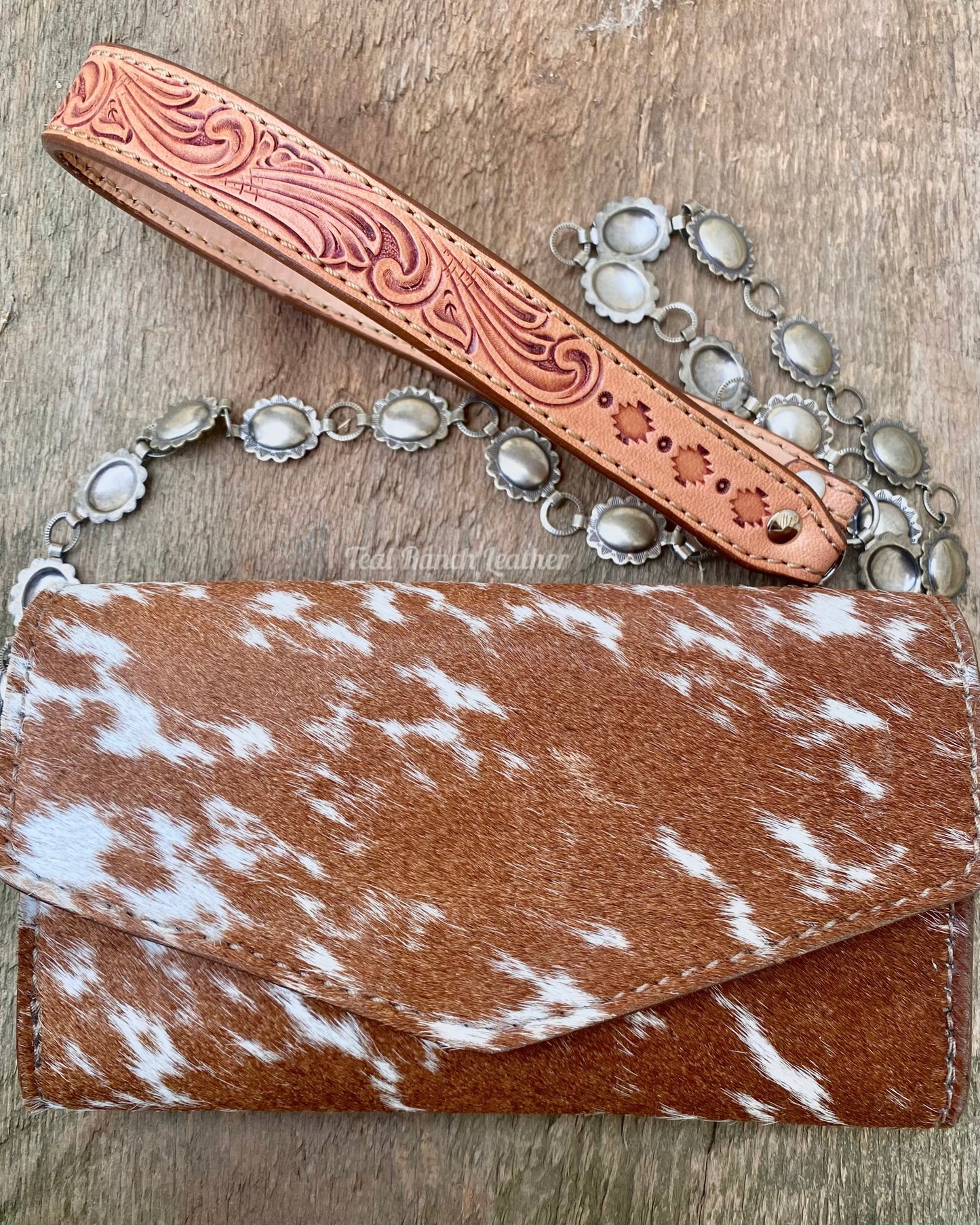 Small hair on hide cross body purse with tooled leather and concho chain- light longhorn