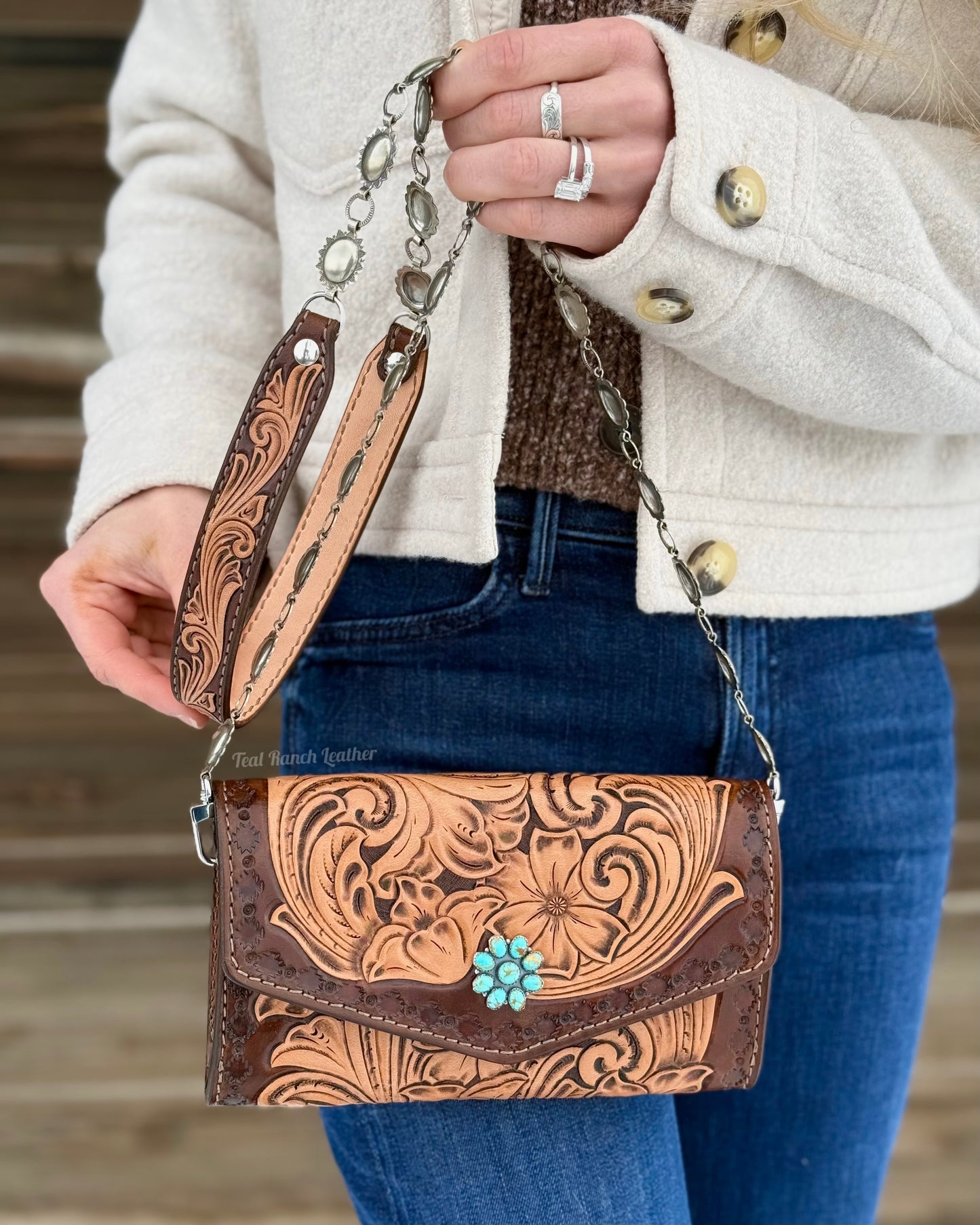 Small tooled leather cross body purse with CH designs turquoise